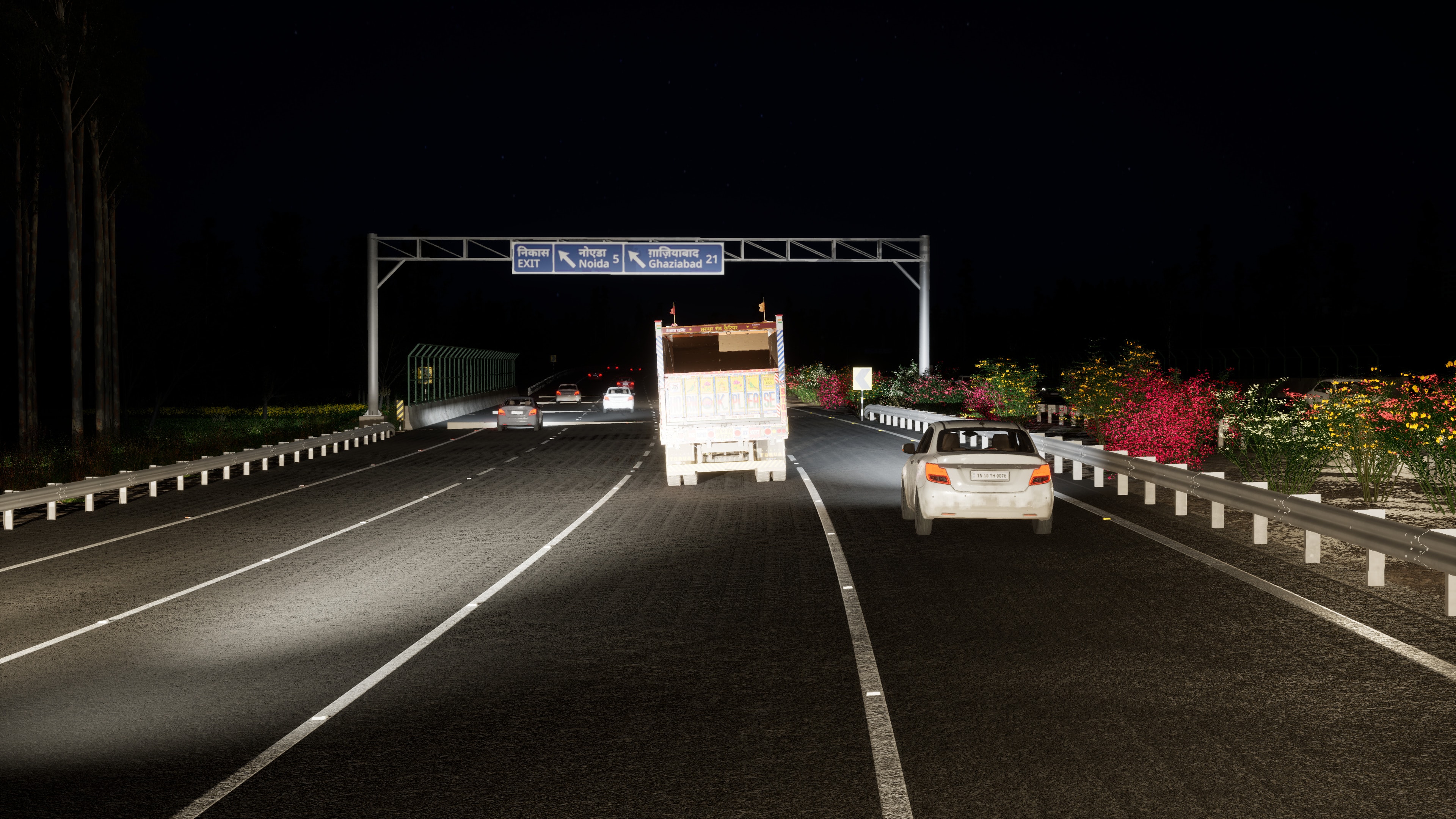 A sign gantry at night